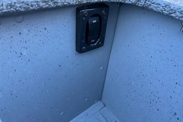 Slide: The Image of Switch panel inside 2026 Lund SSV-16 boat, featuring a manual and automatic toggle. - 9