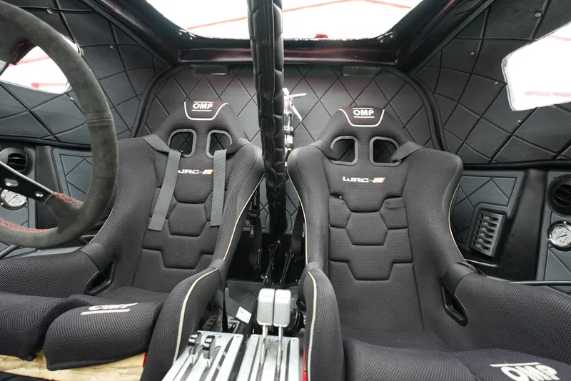 Slide: The Image of Interior of a 2019 Doug Wright 32 with OMP racing seats and quilted paneling. - 10