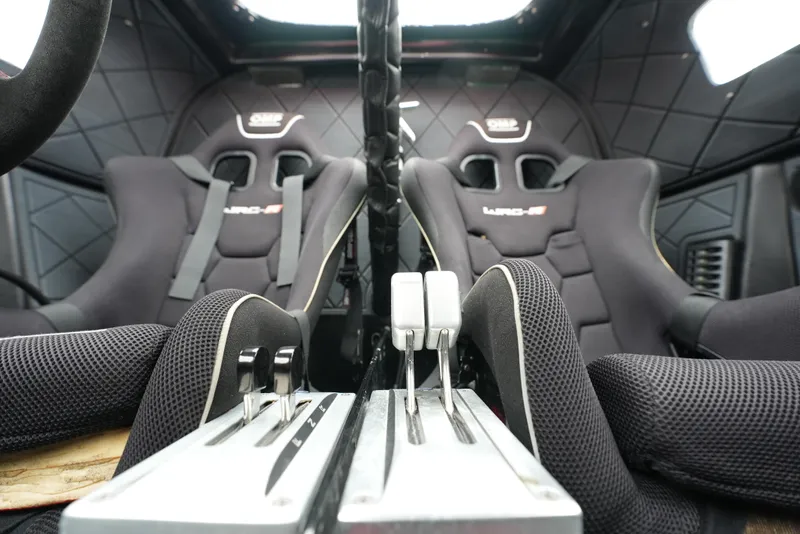 Slide: The Image of Interior of a 2019 Doug Wright 32 boat with racing seats and controls. - 11