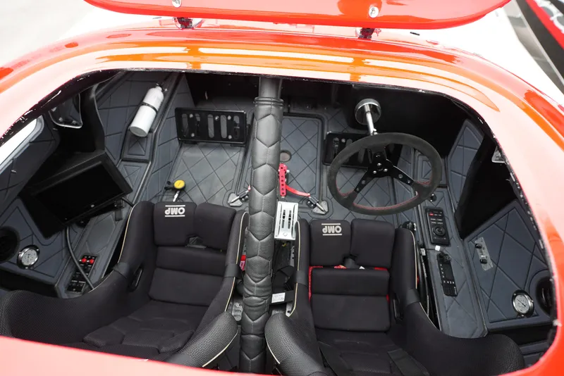 Slide: The Image of Interior of 2019 Doug Wright 32 boat, featuring dual seats and steering wheel. - 18