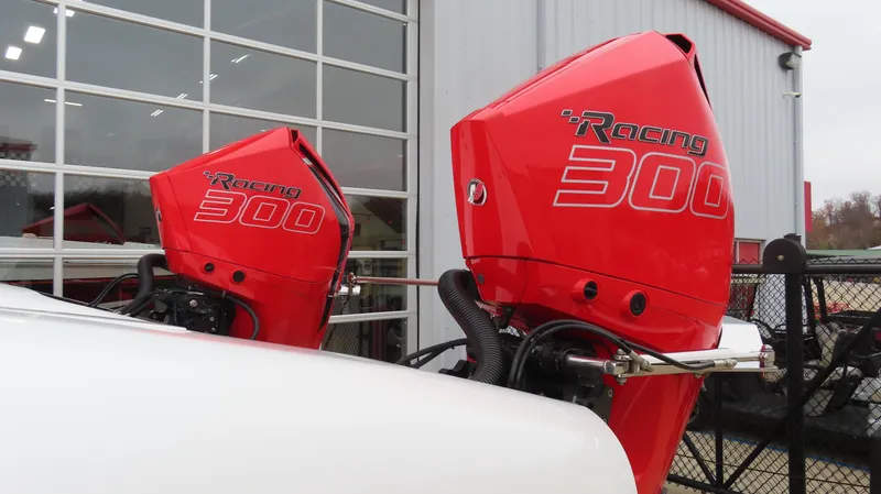 Slide: The Image of Red Racing 300 outboard motors on a 2019 Doug Wright 32 boat. - 3