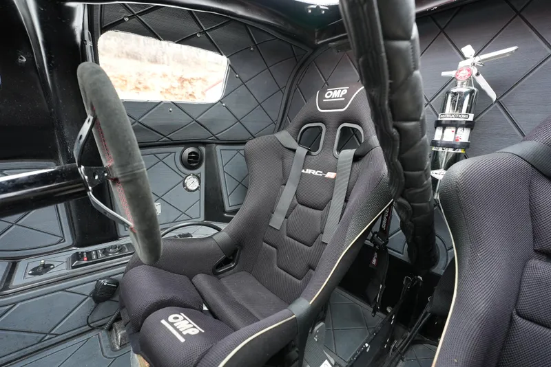 Slide: The Image of Interior of a 2019 Doug Wright 32 boat with OMP racing seats and safety equipment. - 8