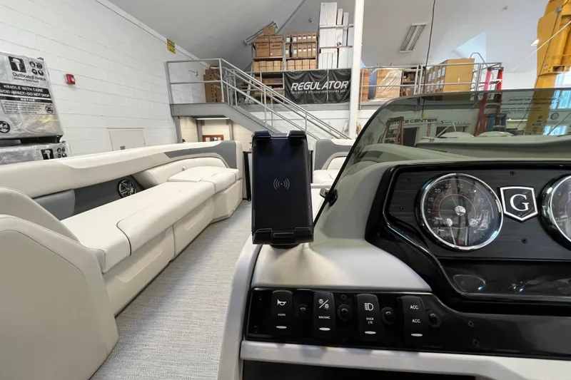 Slide: The Image of Interior of 2026 Godfrey Sweetwater 2286 MT boat with modern dashboard and seating. - 13