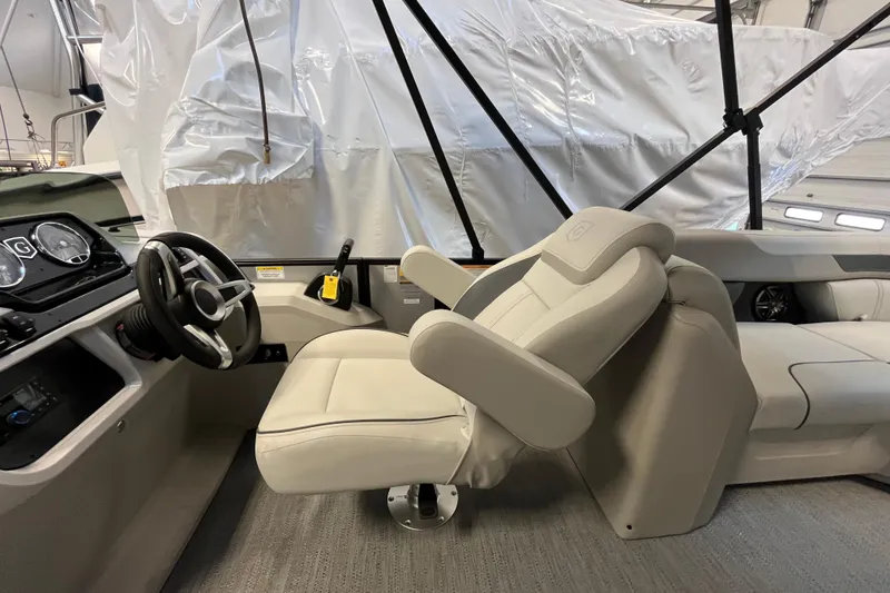 Slide: The Image of Interior of 2026 Godfrey Sweetwater 2286 MT boat with steering wheel and captain's chair. - 17