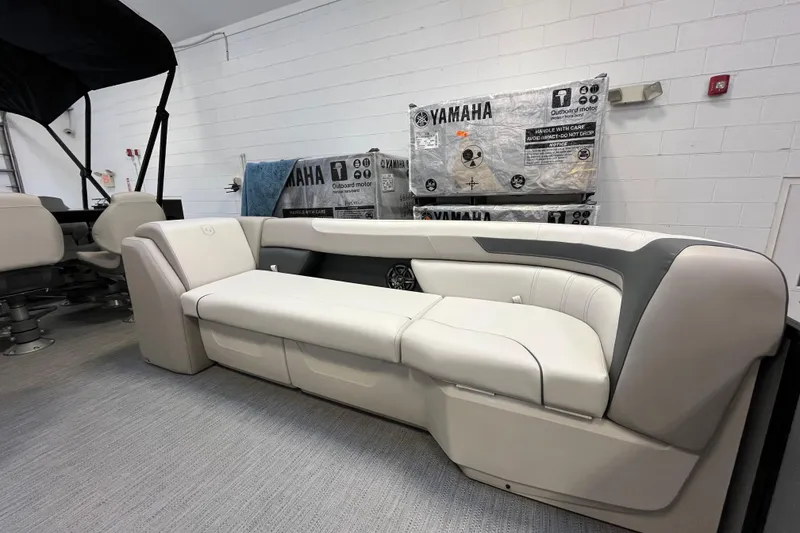 Slide: The Image of 2026 Godfrey Sweetwater 2286 MT boat interior with Yamaha motor packaging. - 18
