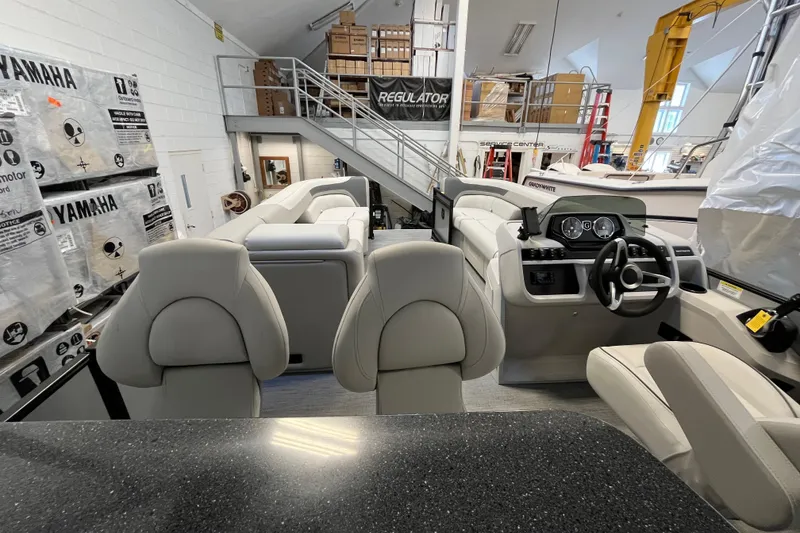 Slide: The Image of 2026 Godfrey Sweetwater 2286 MT pontoon boat interior with modern seating and dashboard. - 25