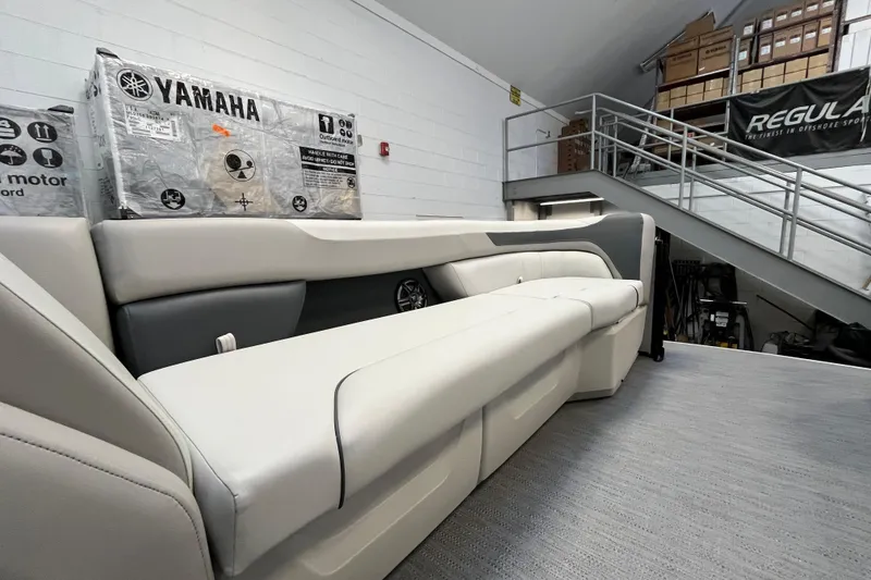 Slide: The Image of 2026 Godfrey Sweetwater 2286 MT boat interior with Yamaha equipment in storage. - 27