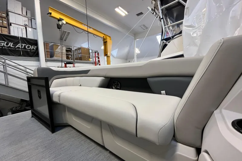 Slide: The Image of 2026 Godfrey Sweetwater 2286 MT boat interior with plush seating in showroom. - 28