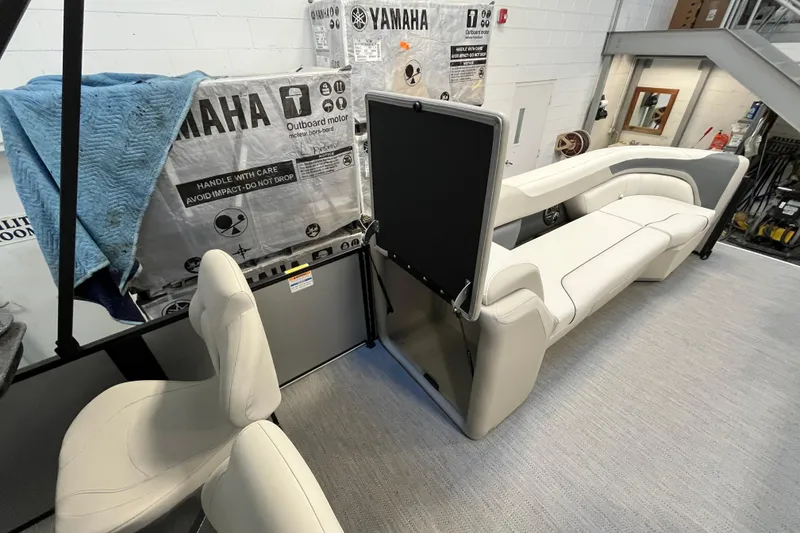 Slide: The Image of 2026 Godfrey Sweetwater 2286 MT interior with Yamaha outboard motor packaging. - 29
