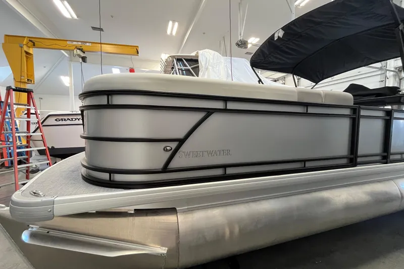Slide: The Image of 2026 Godfrey Sweetwater 2286 MT pontoon boat in a showroom setting. - 4