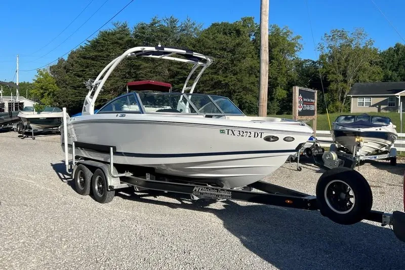 The Image of 2017 Cobalt 220S boat on trailer in outdoor setting, ready for transport. - 0