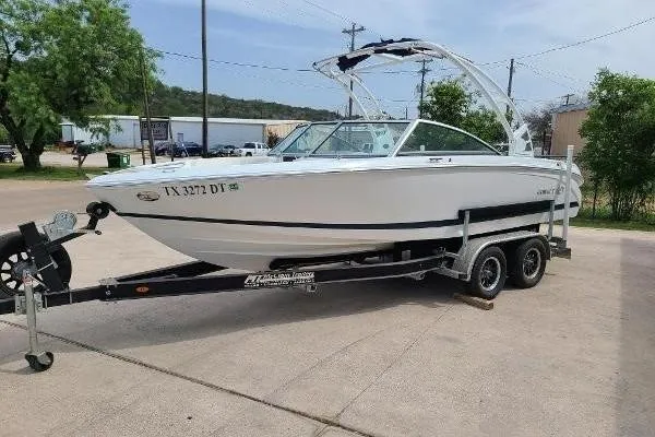 Slide: The Image of 2017 Cobalt 220S boat on trailer in outdoor setting. - 1