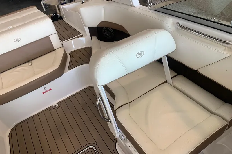 Slide: The Image of Interior of a 2017 Cobalt 220S boat with white and brown seating. - 14