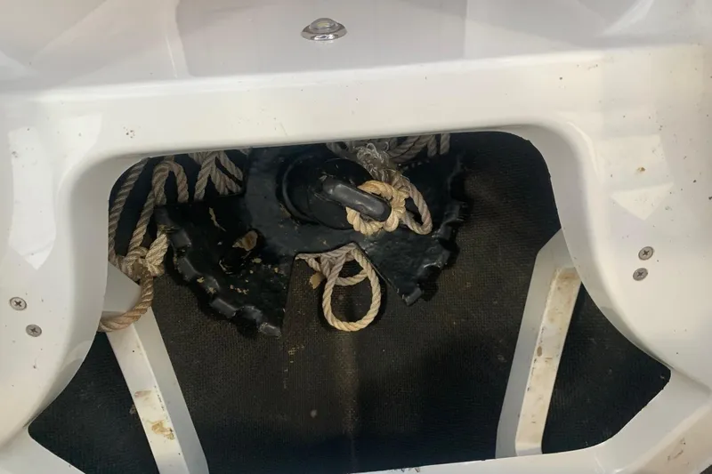 Slide: The Image of Storage compartment with ropes in a 2017 Cobalt 220S boat. - 26