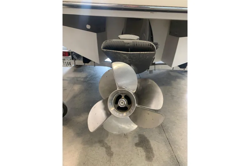 Slide: The Image of 2017 Cobalt 220S boat propeller in a garage setting. - 30