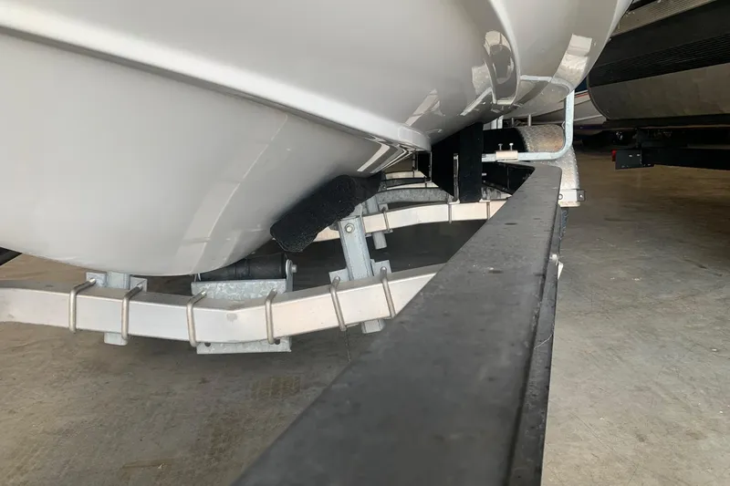 Slide: The Image of 2017 Cobalt 220S boat on trailer, close-up view of hull and support structure. - 32