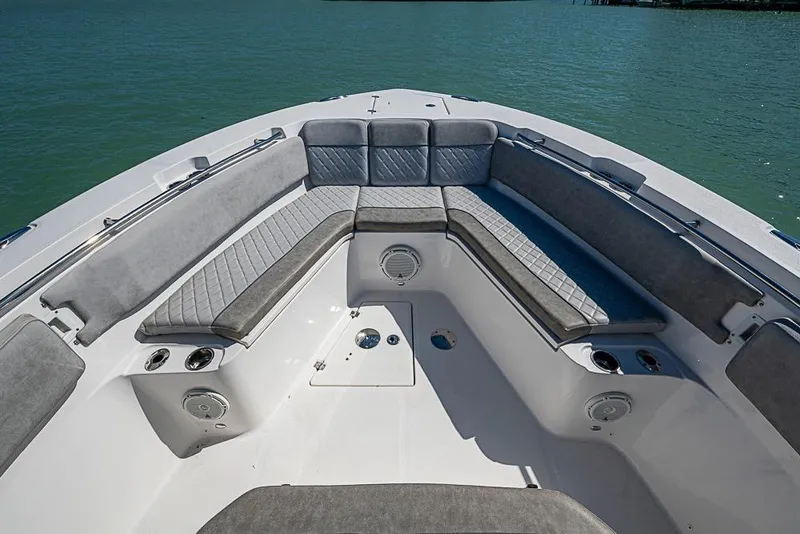 Slide: The Image of 2018 Sea Fox 328 Commander boat interior with cushioned seating and ocean view. - 10