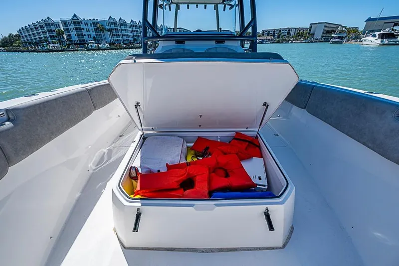 Slide: The Image of Open storage compartment on 2018 Sea Fox 328 Commander boat with life jackets inside. - 14