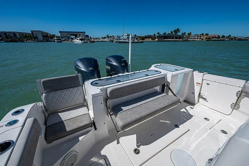 Slide: The Image of 2018 Sea Fox 328 Commander boat interior with seating and dual Yamaha engines. - 15