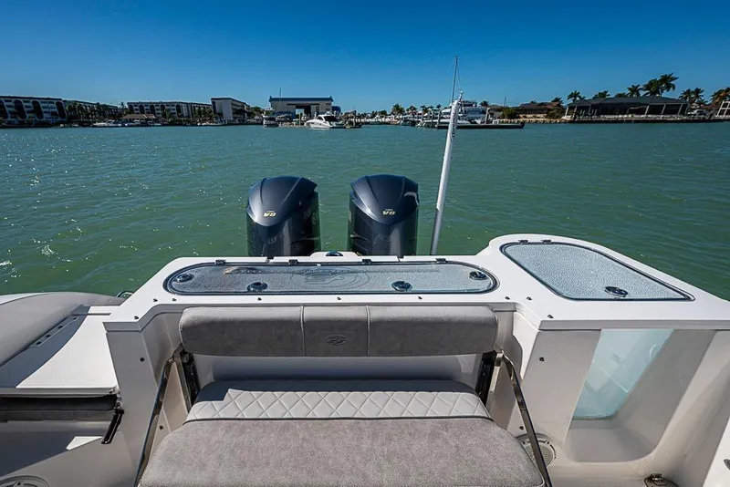 Slide: The Image of 2018 Sea Fox 328 Commander boat with dual engines on calm water. - 17