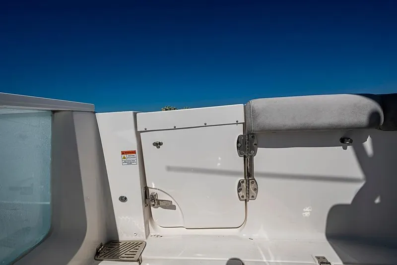 Slide: The Image of 2018 Sea Fox 328 Commander boat interior with white panel and blue sky background. - 18