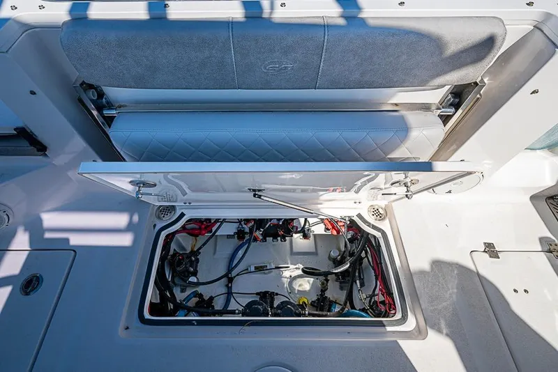 Slide: The Image of 2018 Sea Fox 328 Commander boat storage compartment with open hatch and visible wiring. - 21