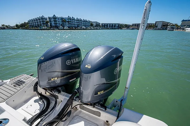 Slide: The Image of 2018 Sea Fox 328 Commander with Yamaha V8 engines on a sunny waterfront. - 22