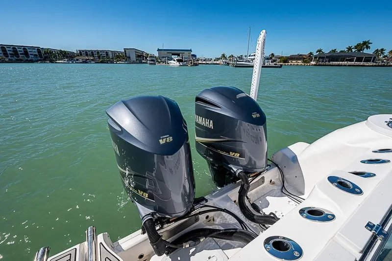 Slide: The Image of 2018 Sea Fox 328 Commander with twin Yamaha V8 engines on a sunny day. - 24