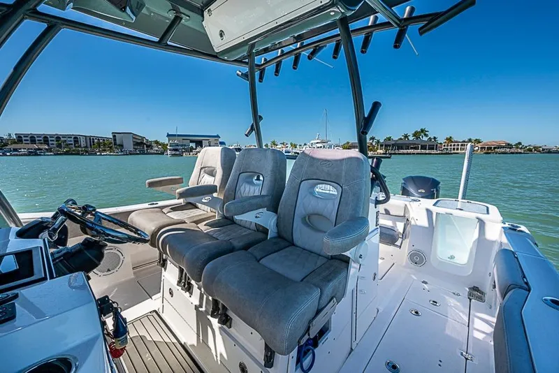 Slide: The Image of 2018 Sea Fox 328 Commander boat interior with plush seating and steering console. - 28