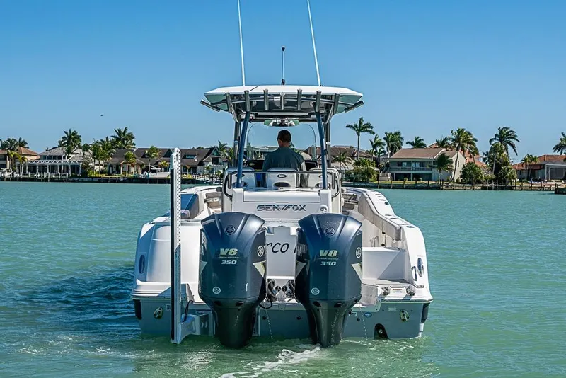 Slide: The Image of 2018 Sea Fox 328 Commander boat with dual V8 engines on a sunny day. - 32