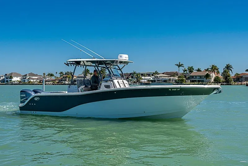 Slide: The Image of 2018 Sea Fox 328 Commander boat cruising on calm waters near coastal homes. - 5