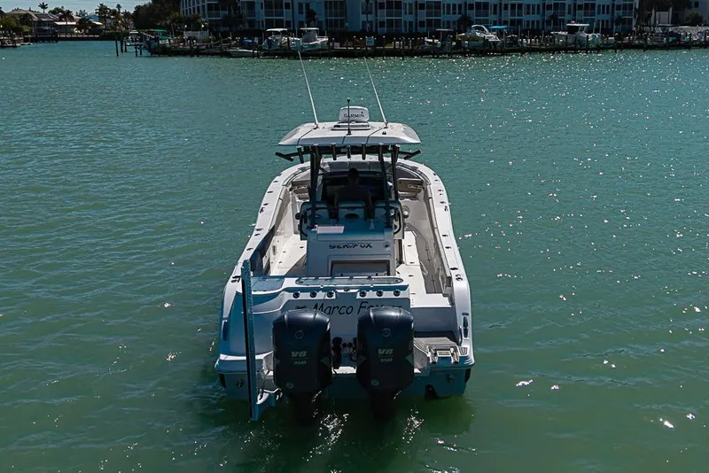 Slide: The Image of 2018 Sea Fox 328 Commander boat on calm water, rear view. - 6