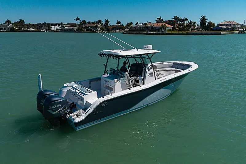 Slide: The Image of 2018 Sea Fox 328 Commander boat on calm water, featuring Yamaha engines. - 7