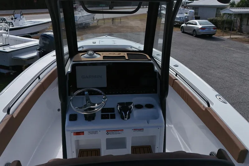Slide: The Image of 2026 Sea Hunt Ultra 275 SE boat cockpit with Garmin navigation system and steering wheel. - 5