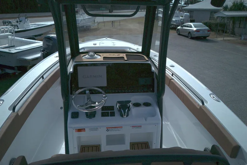 Slide: The Image of 2026 Sea Hunt Ultra 275 SE boat dashboard with Garmin navigation system. - 6