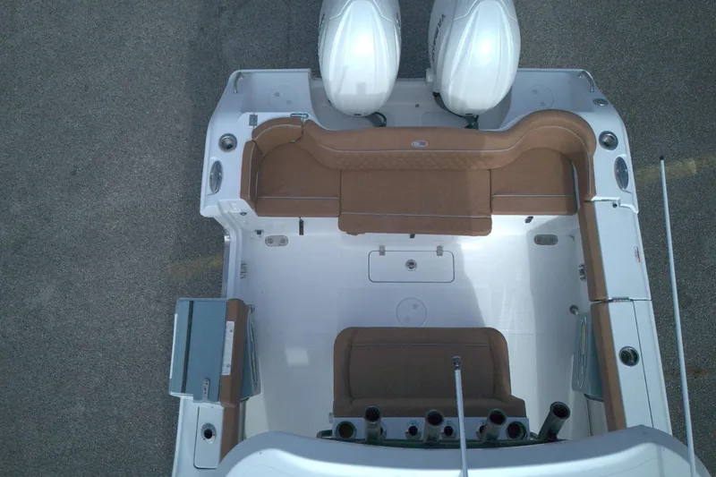 Slide: The Image of Overhead view of 2026 Sea Hunt Ultra 275 SE boat interior with seating and twin engines. - 7