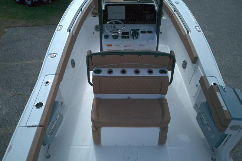Slide: The Image of 2026 Sea Hunt Ultra 275 SE boat interior with seating and control panel. - 8