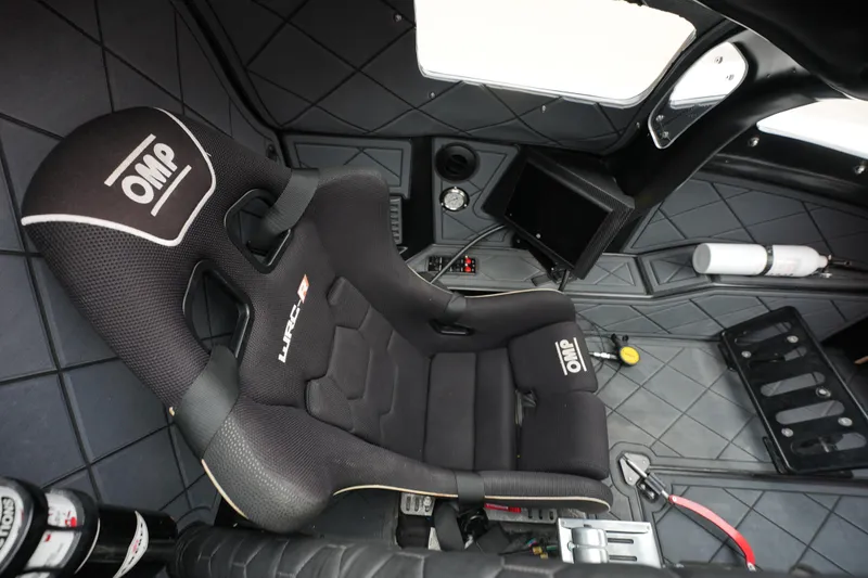 Slide: The Image of 2019 Wright Performance 320 Race cockpit with OMP racing seat and control panel. - 20