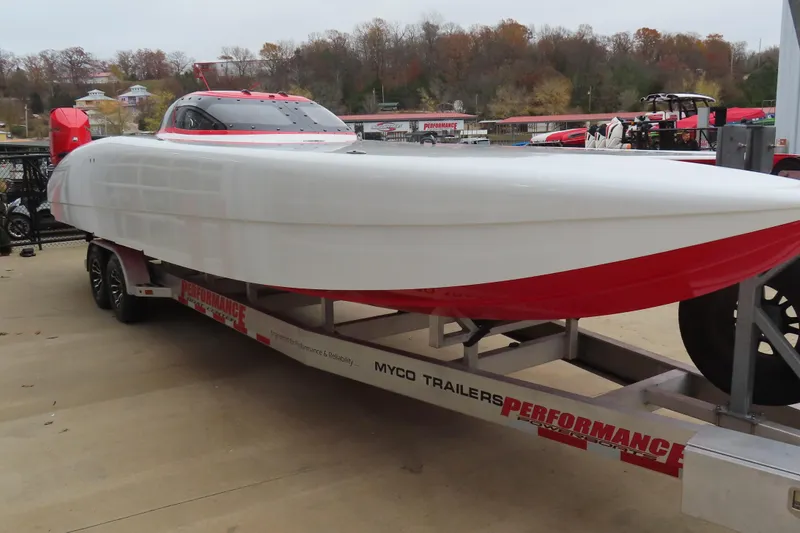 Slide: The Image of 2019 Wright Performance 320 Race boat on trailer, sleek design, red and white color scheme. - 27