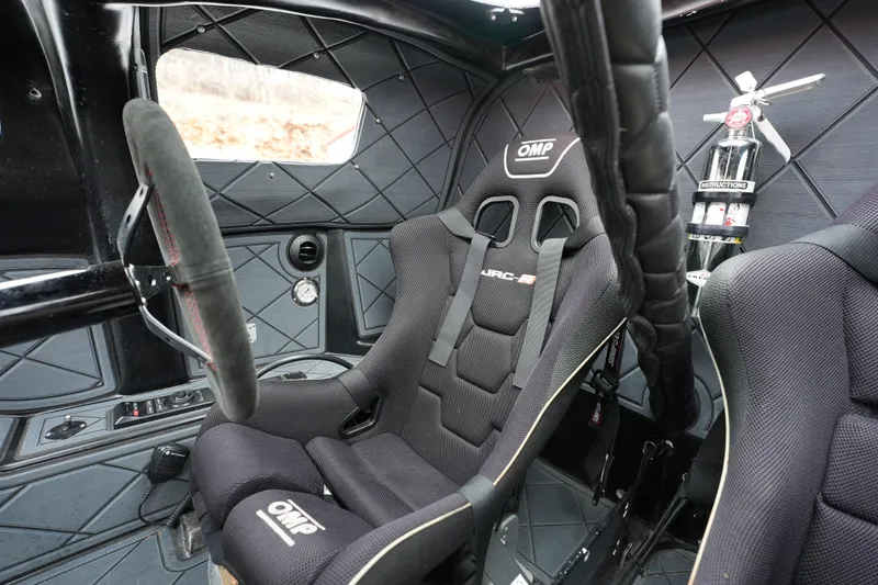 Slide: The Image of Interior of 2019 Wright Performance 320 Race car with racing seat and steering wheel. - 3