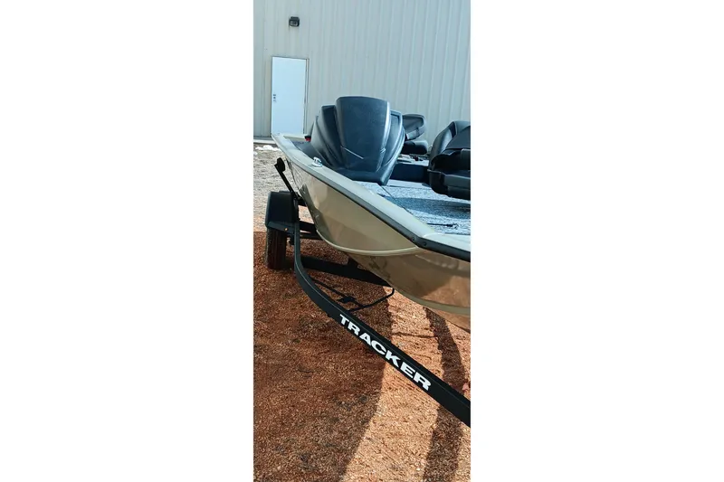 Slide: The Image of 2026 Tracker Pro Team 175 boat on trailer, parked outdoors. - 13