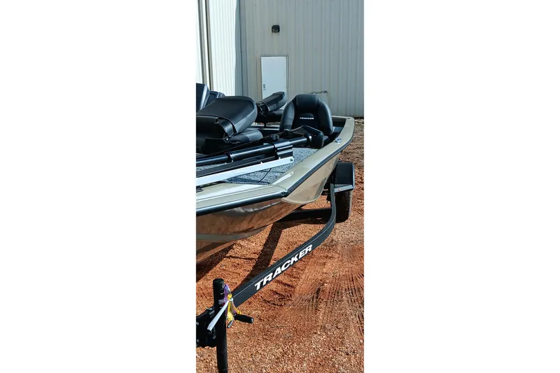 Slide: The Image of 2026 Tracker Pro Team 175 boat on trailer, parked outdoors. - 14