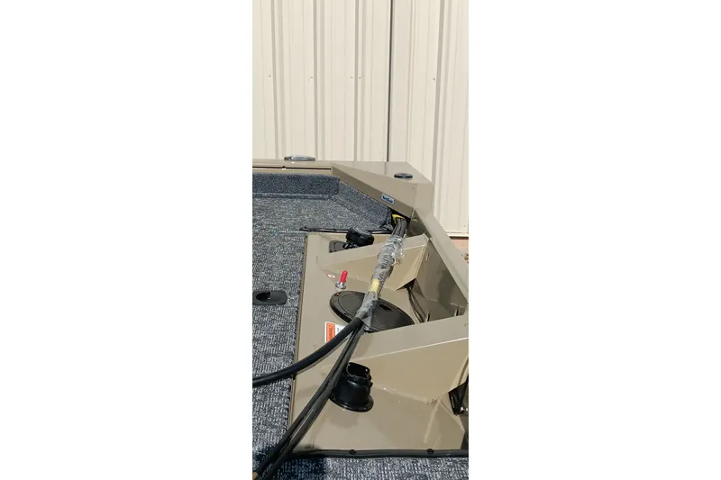 Slide: The Image of 2026 Tracker Pro Team 175 boat interior with equipment and storage compartments. - 18