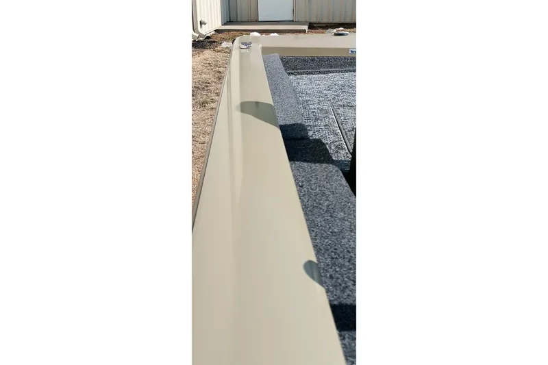 Slide: The Image of 2026 Tracker Pro Team 175 boat interior with beige and gray details. - 23