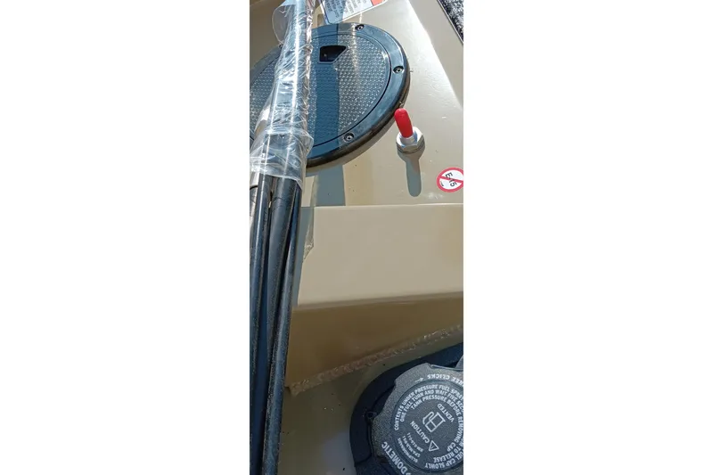 Slide: The Image of 2026 Tracker Pro Team 175 boat dashboard with controls and wiring. - 24