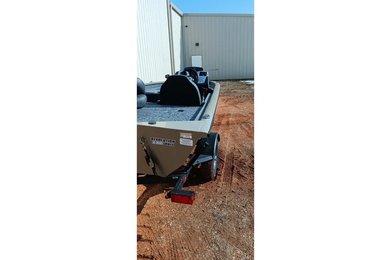 Slide: The Image of 2026 Tracker Pro Team 175 boat on trailer, parked outside a building. - 5