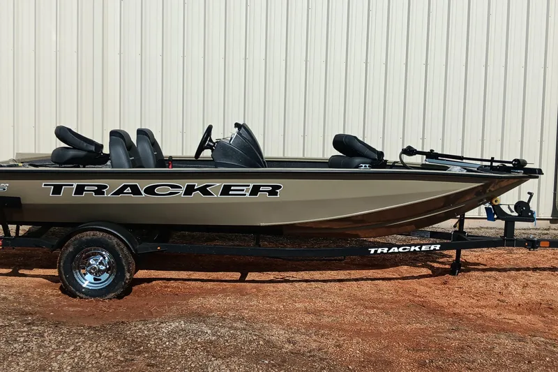 Slide: The Image of 2026 Tracker Pro Team 175 boat on trailer, parked outdoors. - 7