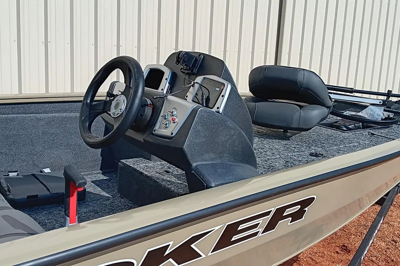 Slide: The Image of 2026 Tracker Pro Team 175 boat interior with steering wheel and seating. - 9