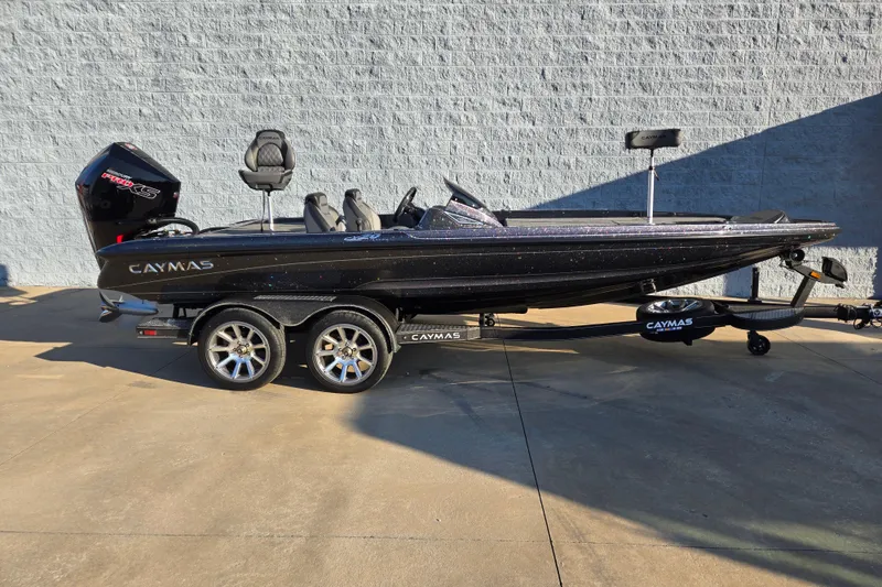 The Image of 2026 Caymas CX 20 PRO bass boat on trailer, side view in sunlight. - 1