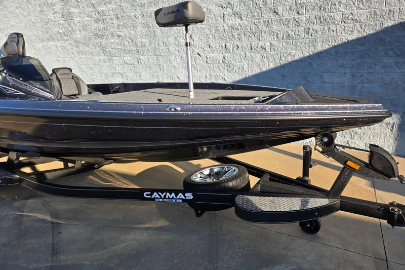 Slide: The Image of 2026 Caymas CX 20 PRO boat on trailer, sleek design, parked outdoors. - 4